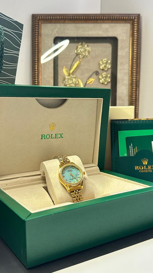 ROLEX FEMME GOLD TABLEAU BLEU CIEL