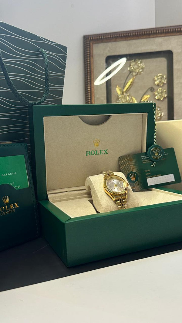 ROLEX FEMME GOLD TABLEAU BLANC